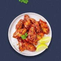 Honey Johnny Bbq Wings · Fresh chicken wings breaded, fried until golden brown, and tossed in honey and barbecue sauc...