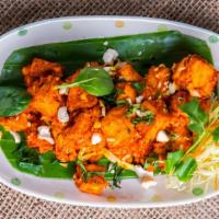 Paneer 555 · Frittered paneer cooked in special sauce.