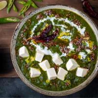 Saag Paneer · Fresh spinach cooked with homemade cheese cubes and spices.