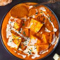 Paneer Tikka Masala · Homemade cheese cooked with bell peppers, onion, tomato and rich creamy sauce.