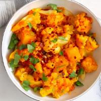 Aloo Gobi Masala · Potatoes and cauliflower cooked in North Indian style gravy.
