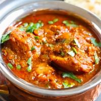 Chicken Vindaloo · Chicken cooked in delicious creamy gravy with potatoes and coriander.