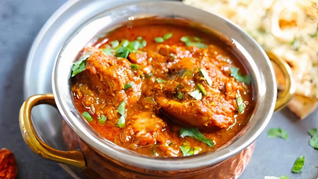 Chicken Vindaloo · Chicken cooked in delicious creamy gravy with potatoes and coriander.