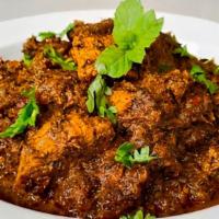 Gongura Goat / Lamb · Goat/lamb cooked with red sorrel leaves and special spices.