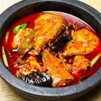 Fish Curry · Fish cooked with spicy Andhra spices and a hint of coconut.
