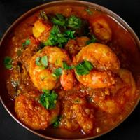 Shrimp Curry · Tender shrimp cooked with spicy Indian spices and a hint of coconut.