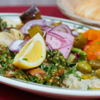 Middle Eastern Combo · Hummus, baba ghannouj, marinated mushrooms, carrots and eggplant, mixed salad, feta cheese, ...