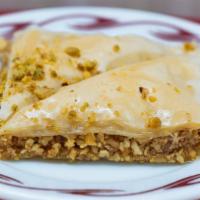 Baklava · Paper thin pastry sandwiched in a layer of crushed nuts, then soakedin honey.