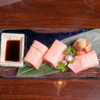 Pink Lady Roll · spicy tuna. avocado. shrimp tempura warpped with pink soy paper. with eel sauce and spicy mayo