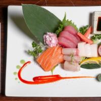Sashimi Deluxe · 15 pcs of chef choice sashimi and sushi rice,served with miso soup and garden salad