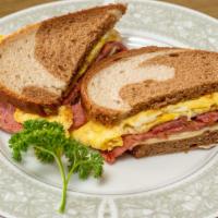 Breakfast Sandwich · Choice of meat, egg, and cheese on the bread of choice.