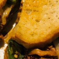 South Of The Border Grilled Cheese Sandwich · Creamy melted Brie layered with chipotle BBQ pulled pork, caramelized onions and jalapenos s...