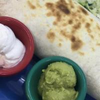Chicken Fajita Burrito · Breast of chicken seasoned in our own blend of fajita spices, grilled with Spanish onions an...