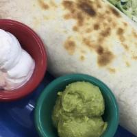 Veggie Fajita Burrito · All of the veggie fajita fixings plus salsa, rolled into one gigantic tortilla. Guacamole & ...