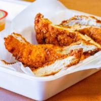 Fresh Chicken Fingers · Breaded & fried chicken strips.
