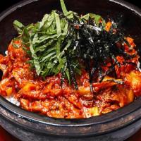 Ojingeo Dolpan Bibimbap · Spicy. Stir fried spicy squid and vegetables over rice in a hot stone plate.