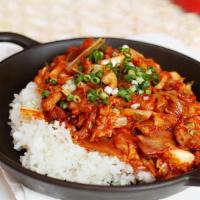 Jeyuk Dolpan Bibimbap · Spicy. Spicy pork and vegetables stir fried with hot pepper sauce served over rice in a hot ...
