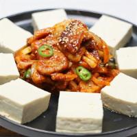 Jeyuk Dubu Kimchi · Spicy. Marinated pork loin and kimchi stir fried with hot pepper sauce served with Dubu on a...