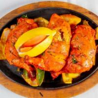 Tandoori Chicken · No gluten ingredients. Tender cornish chicken marinated in yogurt, traditional Indian herbs,...