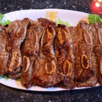 La Galbi 烤牛仔骨 · Marinated beef ribs in a special house sauce, come with 2 Banchan, 1 Bowl of White Rice, 1 G...