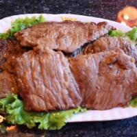 Steak 烤秘制牛排 · Steak with 2 Banchan, 1 Bowl of White Rice, 1 Green Leaf Lettuce, and 1 Sauce.烤秘制牛排，配有2个韩国小碟...