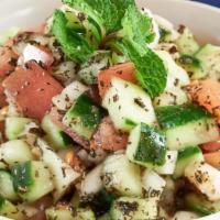 Shirazi Salad · A Persian specialty! Diced cucumber, tomatoes, and onion, seasoned with dry mint & dressed w...