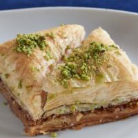 Baklava · Light, crisp, and crumbly dough filled with walnuts, pistachios, and caramelized with honey.