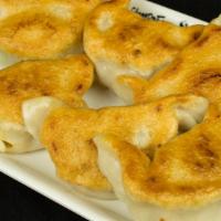 Pan Fried Potstickers 生煎锅贴 · 生煎锅贴 / browned thin skin with pork, ginger, scallion, garlic, 6 pieces.