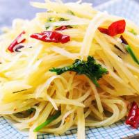 Shredded Potato Stir-Fried W. Peppers. 酸辣土豆丝 · 酸辣土豆丝 / lightly stir fried thin sliced potato, with a hint of peppers. spicy.