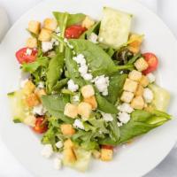 Fattoush Salad · Cucumbers, tomato, parsley, onions, feta cheese, and croutons with
balsamic vinaigrette