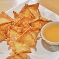 Crab Rangoon · Crab meat and cream cheese filling inside crispy wonton wrappers.
