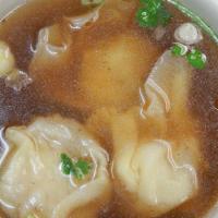 Wonton Soup · Chicken and shrimp wanton in a savory soup with scallions, cilantro, and fried garlic.