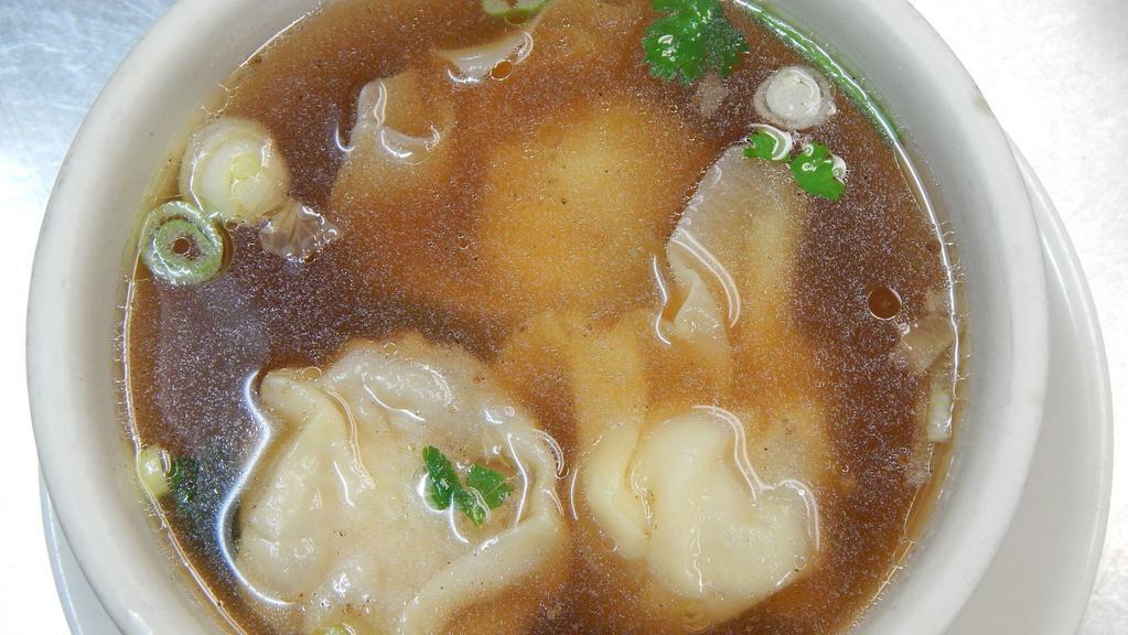Wonton Soup · Chicken and shrimp wanton in a savory soup with scallions, cilantro, and fried garlic.