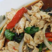 Kra Pow · Choice of meat, veggies sautéed with fresh basil leaves, red peppers, green peppers, and oni...
