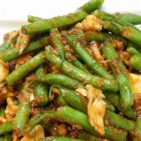 Pad Prik King · Choice of meat, veggies, and string beans stir-fried with red curry paste.