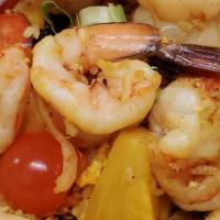 Pineapple Fried Rice · Stir- fried rice with shrimp, chicken, egg, garlic, curry powder, raisins, onions, tomatoes,...
