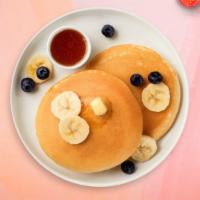 Banana Slices Pancakes Platter  · 2 fluffy banana buttermilk pancakes with choice of meat, eggs and cheese!