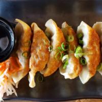 Gyoza · 6 pieces. Steamed or fried dumpling filled with a mixture of pork and chicken. Served with g...
