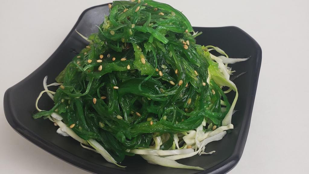 Seaweed Salad · Seasoned seaweed salad with ponzu sprinkled with sesame seeds.