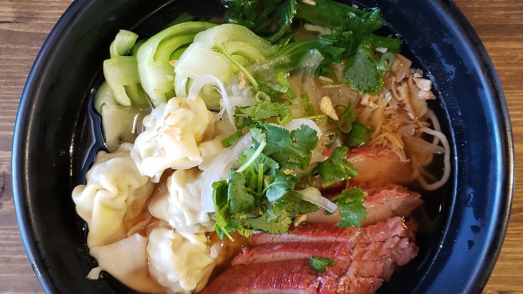 Mi Wonton Pho · Contains egg and shellfish. Chicken broth, pork and shrimp dumplings, ramen noodle, bok choy, and sliced roasted pork.