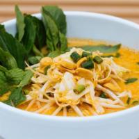Lao Curry Soup · Red and green curries, fresh rice noodles, long beans, peanut, lime, shredded cabbage, bean ...