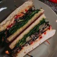 Portobello Mushroom Sandwich · House-made bread with portobello mushrooms, Asiago, mozzarella, spinach, roasted red peppers...