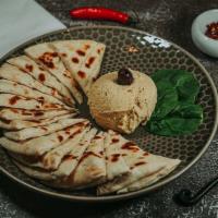 Hummus & Pita · Chickpea and tahini spread served with warm pita triangles.
