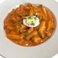 Rose Ddeok-Bokki · Rice cakes and fish cakes reduced in a sweet and spicy red chili sauce with creamy flavor.