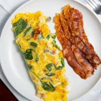 Vegetable Omelet · Green peppers, spinach, tomato, onions and mushrooms. Served with three eggs, home fries or ...