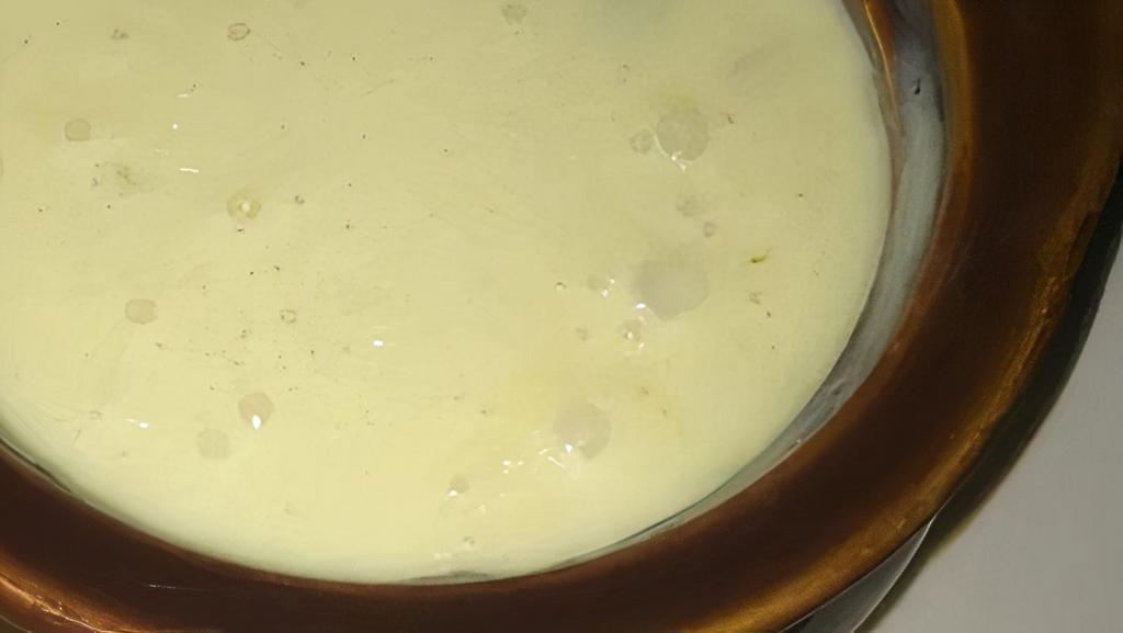 Queso Blanco · Spicy white cheese dip. (served with chips).