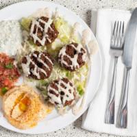Falafel · Two balls of fried chickpeas seasoned with a selection of Middle Eastern herbs and spices. S...