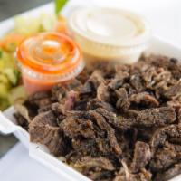 Lamb Shawarma Plate · Thin slices of marinated lamb and beef broiled to perfection and shaved over rice pilaf and ...
