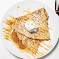 Nana'S Pie · Cooked apples with cinnamon almonds and brown sugar topped with caramel and whipped cream.