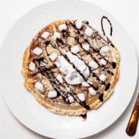 Campfire Crepe Waffle · Graham crackers and mini marshmallows on a Nutella spread. Topped with caramel, chocolate or...